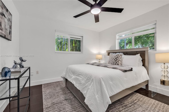 615 NE 115th St, Biscayne Park, FL 33161 - bedroom with baseboards, wood finished floors, and ceiling fan