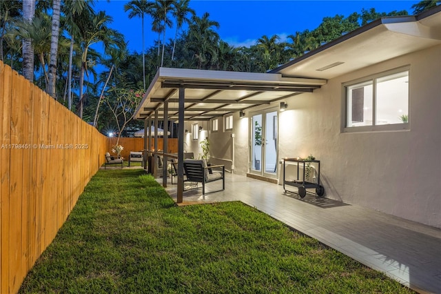 615 NE 115th St, Biscayne Park, FL 33161 - view of yard featuring french doors and a patio area