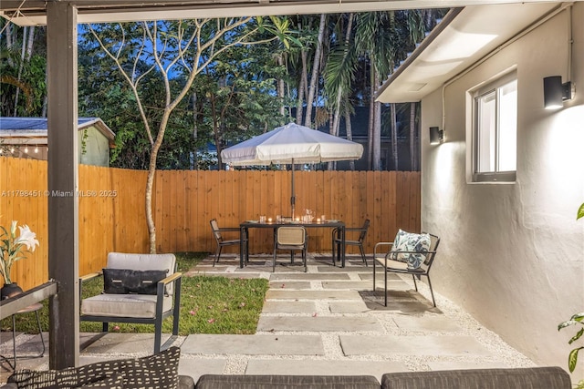 615 NE 115th St, Biscayne Park, FL 33161 - view of patio / terrace featuring outdoor dining space and fence