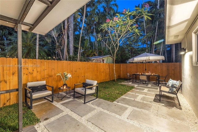 615 NE 115th St, Biscayne Park, FL 33161 - view of patio / terrace featuring a fenced backyard and outdoor dining area