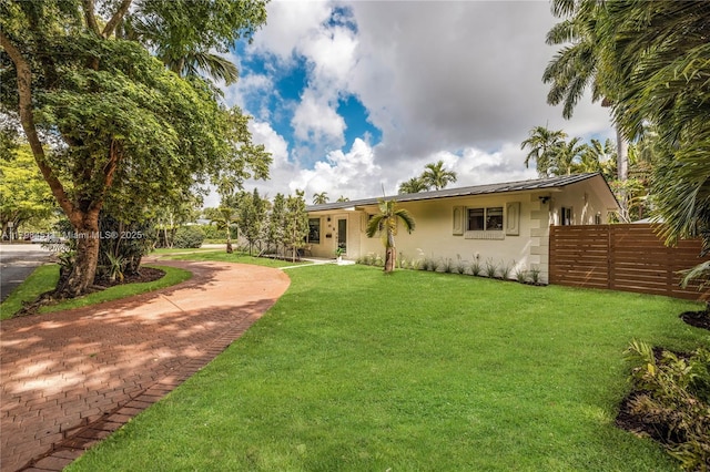615 NE 115th St, Biscayne Park, FL 33161 - ranch-style home featuring stucco siding