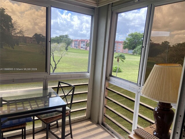 9581 Sunrise Lakes Blvd Unit 202, Sunrise, FL 33322 - living room featuring a ceiling fan, wood finished floors, and a textured ceiling