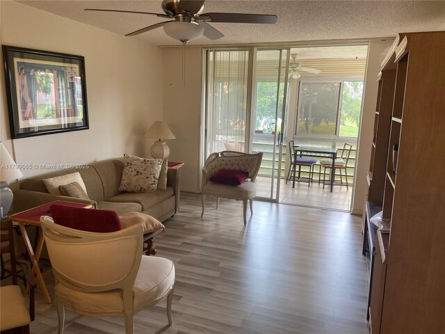 9581 Sunrise Lakes Blvd Unit 202, Sunrise, FL 33322 - dining area featuring a ceiling fan, a textured ceiling, and wood finished floors