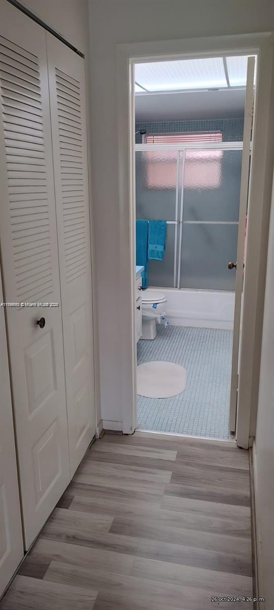 9581 Sunrise Lakes Blvd Unit 202, Sunrise, FL 33322 - hall with light wood-type flooring