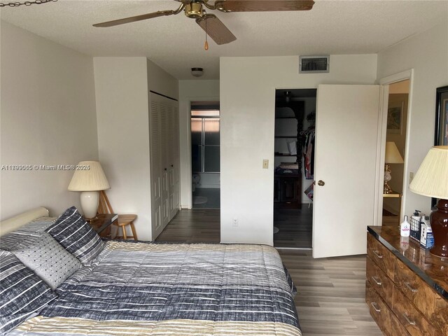 9581 Sunrise Lakes Blvd Unit 202, Sunrise, FL 33322 - bedroom with wood finished floors, ceiling fan, and a closet