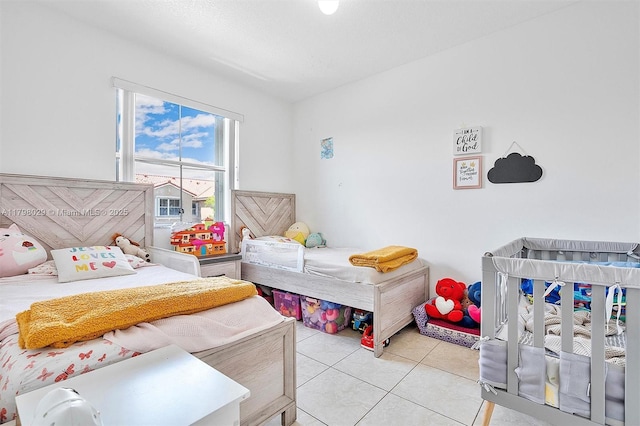 bedroom with light tile patterned floors