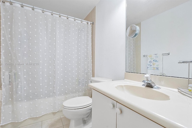 bathroom featuring tile patterned flooring, toilet, vanity, and a shower with curtain