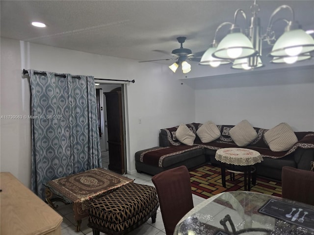 tiled living room featuring ceiling fan and recessed lighting