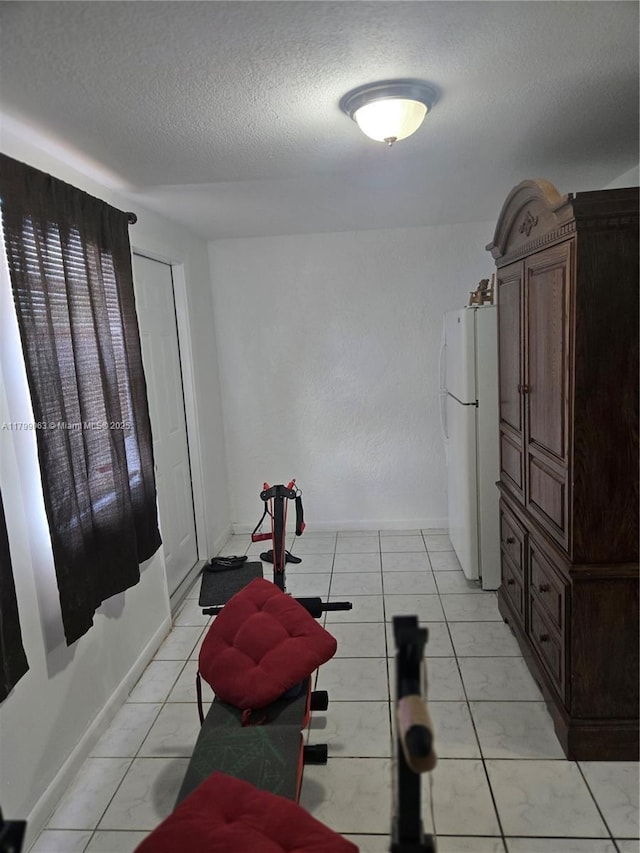 exercise area with a textured ceiling