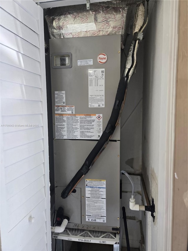utility room featuring heating unit