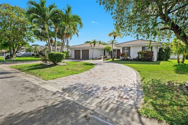 3215 NW 114th Ln, Coral Springs, FL 33065 - ranch-style house with an attached garage, decorative driveway, a front lawn, and a tiled roof