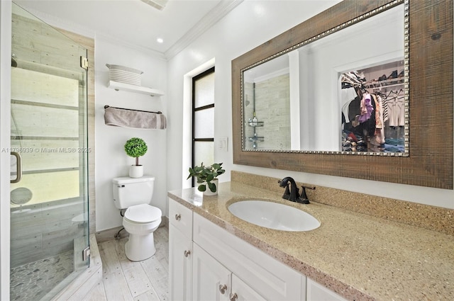 3215 NW 114th Ln, Coral Springs, FL 33065 - bathroom with ornamental molding, a shower stall, toilet, wood finished floors, and vanity