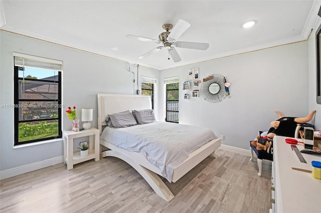3215 NW 114th Ln, Coral Springs, FL 33065 - bedroom with light wood-style floors, multiple windows, baseboards, crown molding, and a ceiling fan