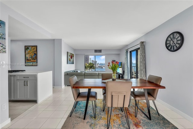 2201 Brickell Ave Unit 77, Miami, FL 33129 - dining area featuring light tile patterned flooring and baseboards