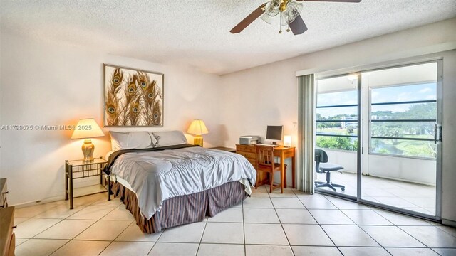 3087 Newport S Unit 3087, Deerfield Beach, FL 33442 - tiled bedroom with access to outside, a textured ceiling, and ceiling fan