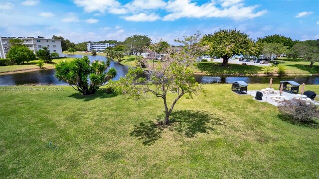3087 Newport S Unit 3087, Deerfield Beach, FL 33442 - view of green lawn featuring a water view