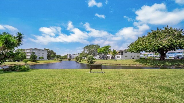 3087 Newport S Unit 3087, Deerfield Beach, FL 33442 - view of property's community with a water view and a lawn