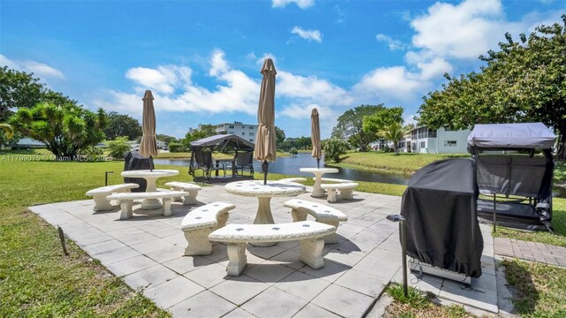 3087 Newport S Unit 3087, Deerfield Beach, FL 33442 - view of patio / terrace with a gazebo, area for grilling, and a water view