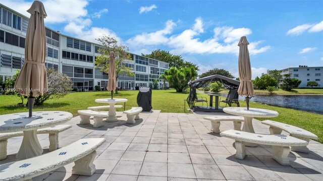 3087 Newport S Unit 3087, Deerfield Beach, FL 33442 - surrounding community featuring a yard, a patio, a water view, and a gazebo