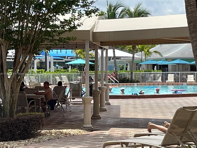 3087 Newport S Unit 3087, Deerfield Beach, FL 33442 - community pool featuring fence and a patio