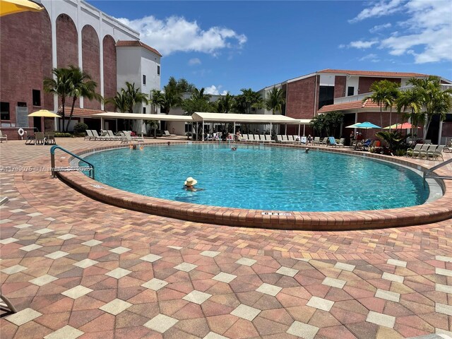3087 Newport S Unit 3087, Deerfield Beach, FL 33442 - community pool featuring a patio area