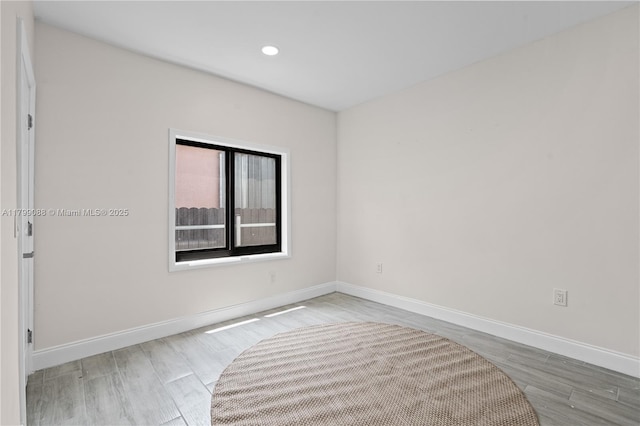 1824 NW 47th St, Miami, FL 33142 - spare room featuring wood finished floors, baseboards, and recessed lighting