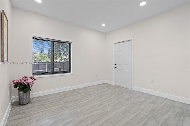 1824 NW 47th St, Miami, FL 33142 - unfurnished room with light wood finished floors, recessed lighting, and baseboards