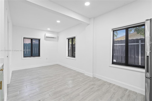 1824 NW 47th St, Miami, FL 33142 - spare room featuring a wall mounted AC, plenty of natural light, light wood finished floors, baseboards, and recessed lighting