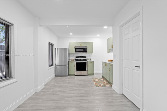 1824 NW 47th St, Miami, FL 33142 - kitchen with green cabinets, appliances with stainless steel finishes, light countertops, baseboards, and recessed lighting