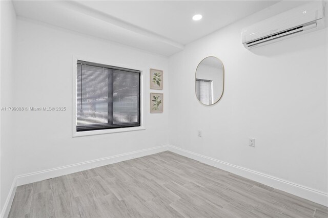 1824 NW 47th St, Miami, FL 33142 - kitchen featuring stainless steel appliances, light wood finished floors, recessed lighting, a kitchen bar, and baseboards