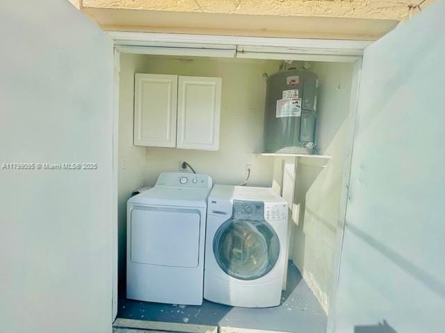 3672 SW 59th Ave Unit 7, Davie, FL 33314 - clothes washing area with separate washer and dryer, cabinet space, and water heater