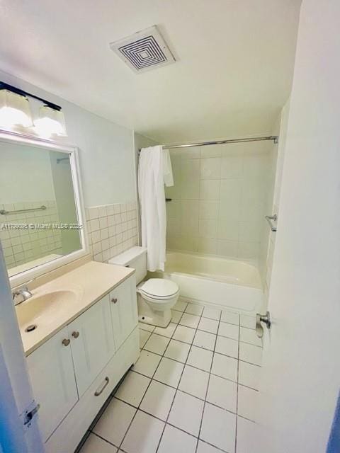 3672 SW 59th Ave Unit 7, Davie, FL 33314 - bathroom featuring tile patterned floors, toilet, shower / bathtub combination with curtain, vanity, and tile walls