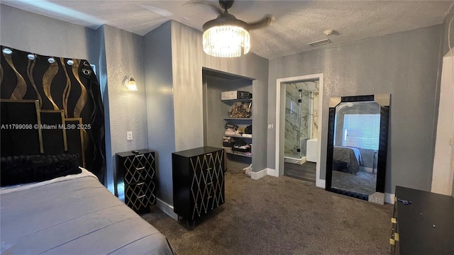carpeted bedroom with a textured ceiling, baseboards, and a ceiling fan