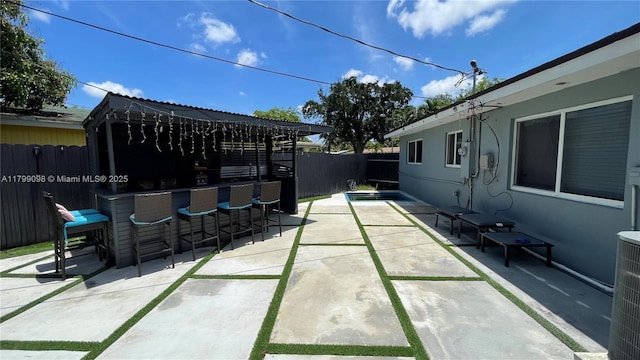 view of patio featuring a fenced backyard and central AC unit