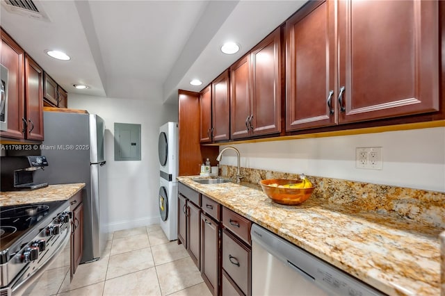 9456 SW 77th Ave Unit T6, Miami, FL 33156 - kitchen with stacked washing machine and dryer, appliances with stainless steel finishes, electric panel, recessed lighting, and dark brown cabinets