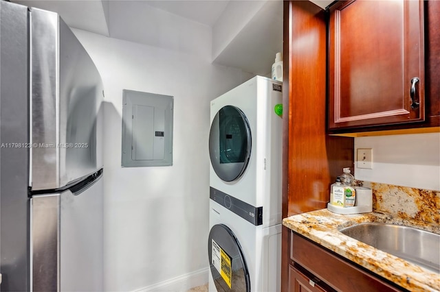 9456 SW 77th Ave Unit T6, Miami, FL 33156 - laundry room featuring electric panel and stacked washer and clothes dryer