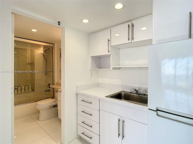 555 NE 15th St Unit 502, Miami, FL 33132 - bathroom featuring tile patterned flooring, toilet, recessed lighting, vanity, and enclosed tub / shower combo