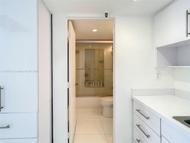 555 NE 15th St Unit 502, Miami, FL 33132 - full bath with tile patterned floors, vanity, toilet, recessed lighting, and bath / shower combo with glass door