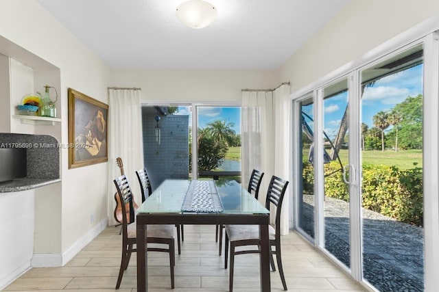 5715 Bayberry Ln, Tamarac, FL 33319 - dining area with light wood finished floors and baseboards