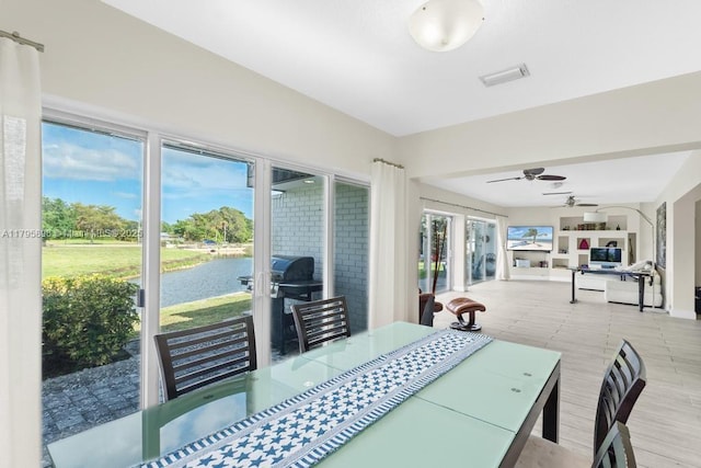 5715 Bayberry Ln, Tamarac, FL 33319 - dining area featuring a water view and ceiling fan