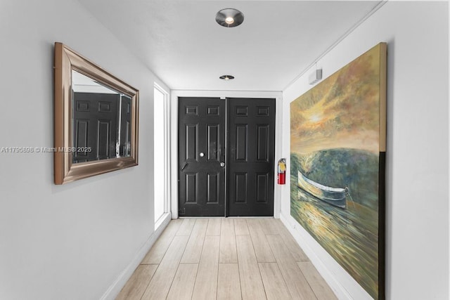 5715 Bayberry Ln, Tamarac, FL 33319 - corridor featuring light wood-style floors and baseboards
