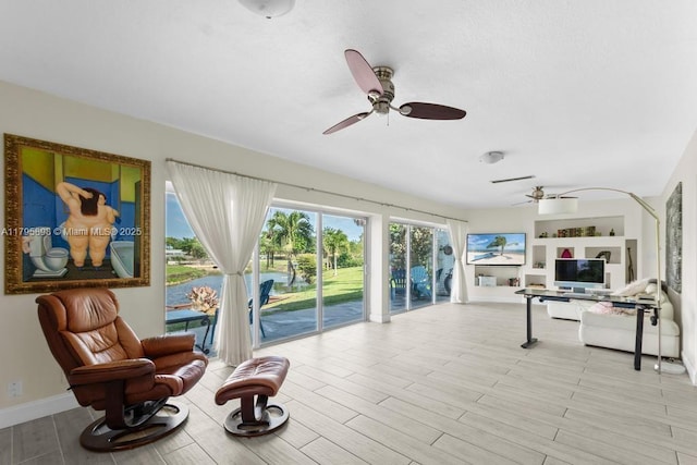 5715 Bayberry Ln, Tamarac, FL 33319 - living area featuring ceiling fan, wood finished floors, and built in shelves