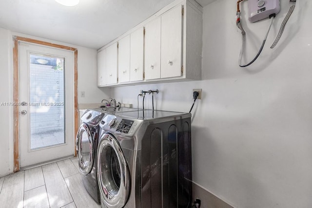5715 Bayberry Ln, Tamarac, FL 33319 - laundry room featuring cabinet space and washer and clothes dryer