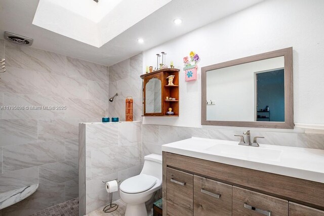5715 Bayberry Ln, Tamarac, FL 33319 - bathroom with walk in shower, tile walls, vanity, toilet, and recessed lighting