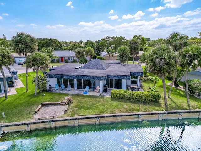 5715 Bayberry Ln, Tamarac, FL 33319 - back of property with a patio area, a water view, and a lawn