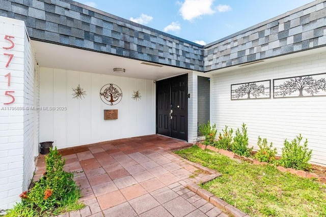 5715 Bayberry Ln, Tamarac, FL 33319 - entrance to property featuring mansard roof and roof with shingles