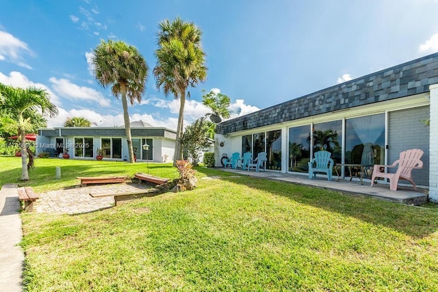 5715 Bayberry Ln, Tamarac, FL 33319 - back of property with a yard and a patio