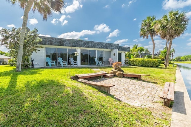 5715 Bayberry Ln, Tamarac, FL 33319 - back of property featuring a yard and brick siding