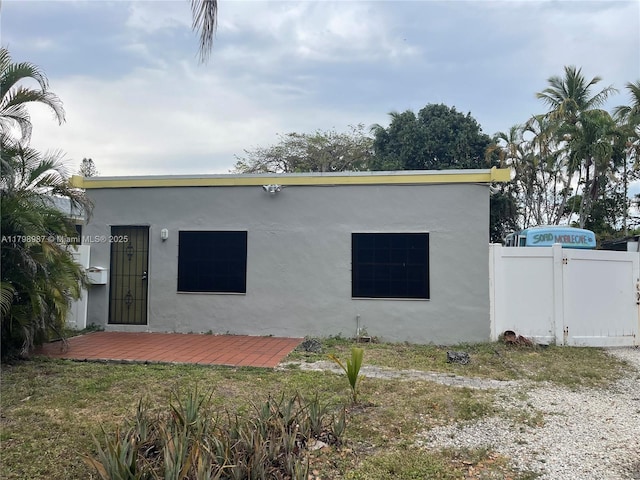 2415 Garfield St, Hollywood, FL 33020 - view of front of home with fence and stucco siding