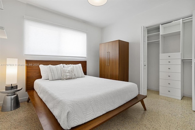 950 NE 88th St, Miami, FL 33138 - bedroom featuring dark aggregate flooring, baseboards, and a closet